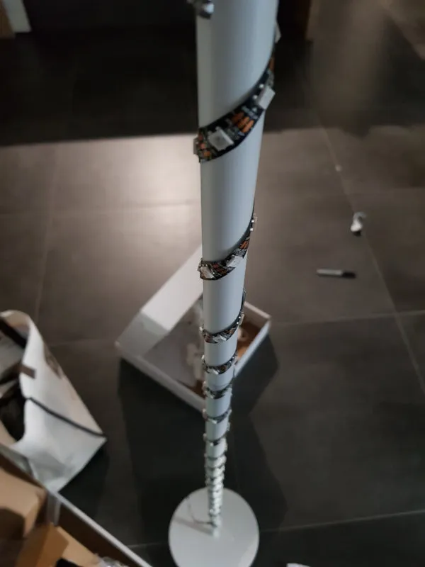 The LED strip wrapped around the base